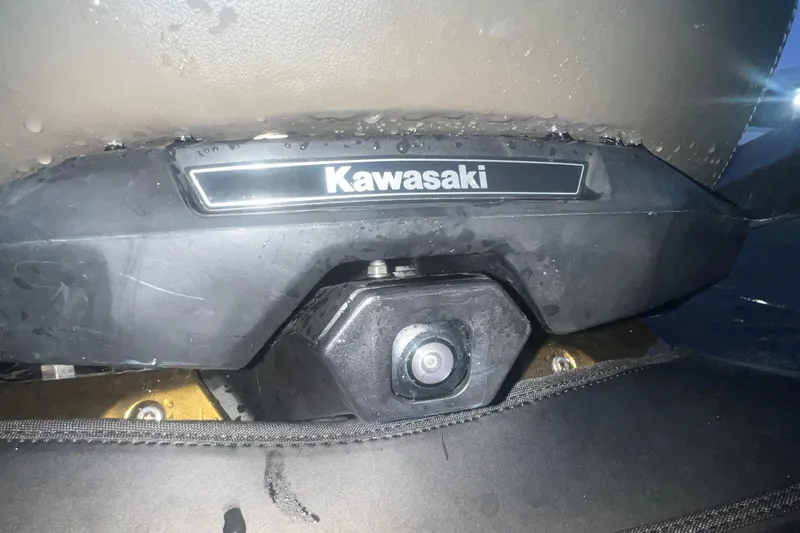 Slide: The Image of Close-up of 2023 Kawasaki Jetski Ultra 310LX-S seat with logo and camera. - 19
