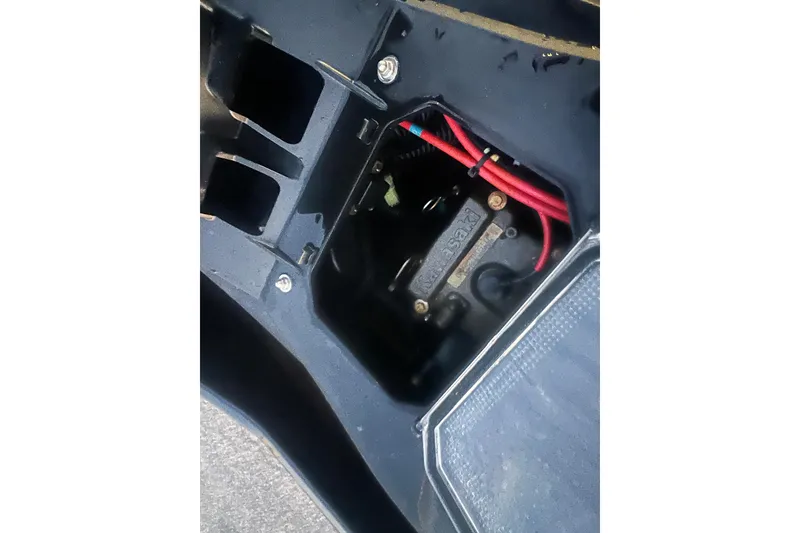 Slide: The Image of 2023 Kawasaki Jetski Ultra 310LX-S engine compartment with visible wiring and components. - 23