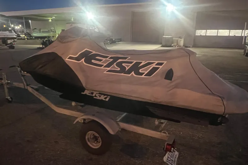 Slide: The Image of 2023 Kawasaki Jetski Ultra 310LX-S covered on trailer at night. - 26