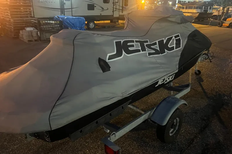 Slide: The Image of 2023 Kawasaki Jetski Ultra 310LX-S covered on trailer at dusk. - 27
