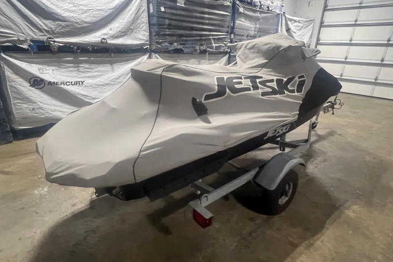 Slide: The Image of 2023 Kawasaki Jetski Ultra 310LX-S covered on trailer in garage. - 31