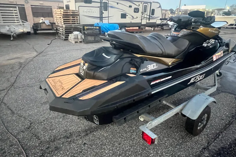 Slide: The Image of 2023 Kawasaki Jetski Ultra 310LX-S on trailer, parked in outdoor lot. - 5