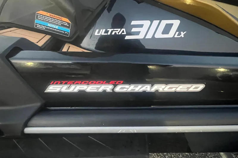 Slide: The Image of 2023 Kawasaki Jetski Ultra 310LX-S, featuring intercooled supercharged engine branding. - 7
