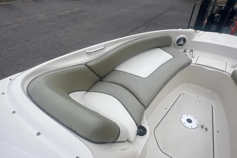 Slide: The Image of 2006 Sea Ray 240 Sundeck dashboard with wood accents and steering wheel. - 15