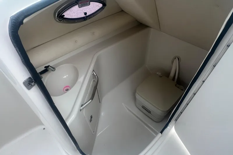 Slide: The Image of 2006 Sea Ray 240 Sundeck stereo system with control panel and buttons. - 21