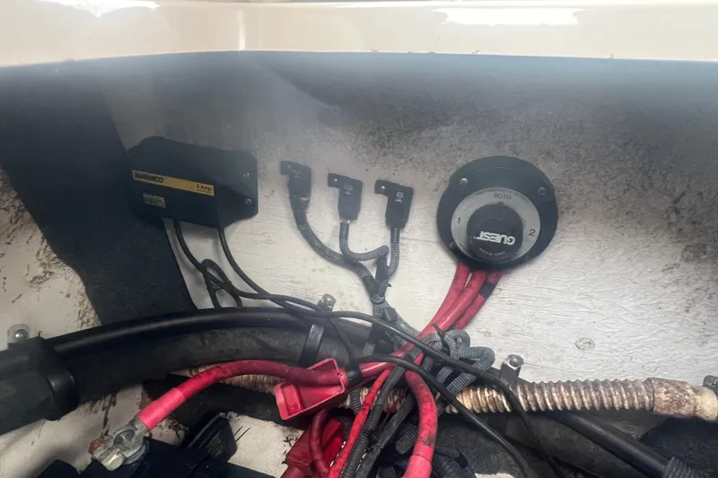 Slide: The Image of 2006 Sea Ray 240 Sundeck interior with seating and cup holders. - 28