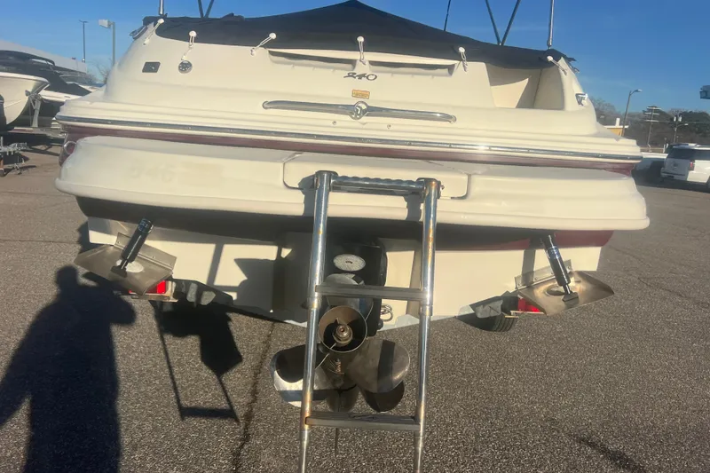 Slide: The Image of Rear view of a 2006 Sea Ray 240 Sundeck boat with ladder and propellers. - 38