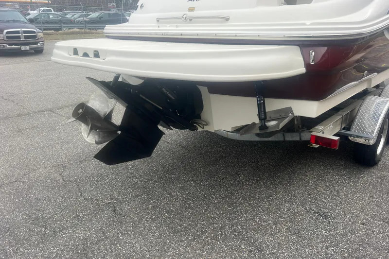 Slide: The Image of 2006 Sea Ray 240 Sundeck boat on trailer, rear view showing propeller and hull. - 4