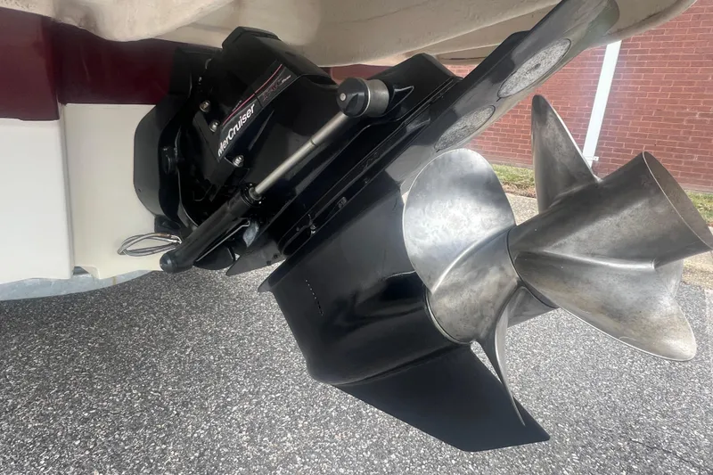 Slide: The Image of 2006 Sea Ray 240 Sundeck boat on trailer, parked outdoors. - 8