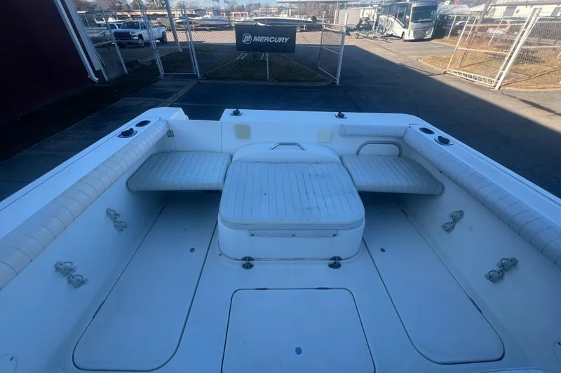 Slide: The Image of 2004 Trophy 2352 Walkaround boat interior with seating and storage compartments. - 15