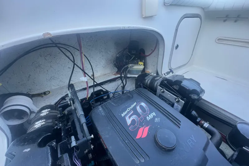 Slide: The Image of Engine compartment of a 2004 Trophy 2352 Walkaround boat with MerCruiser 5.0 MPI engine. - 32