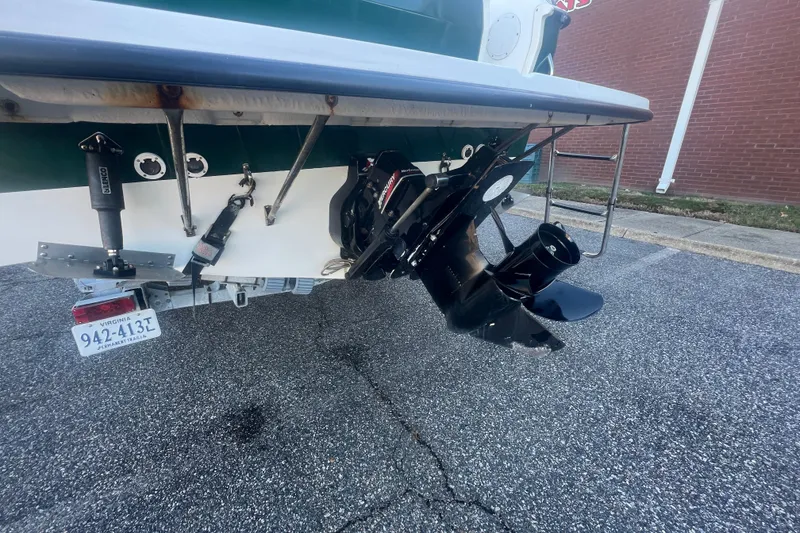 Slide: The Image of Rear view of a 2004 Trophy 2352 Walkaround boat with visible outboard motor. - 5