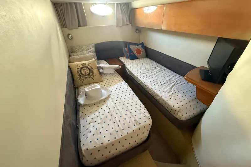 Slide: The Image of Twin cabin interior of 2002 Viking Princess V50 yacht with cozy bedding and decor. - 14