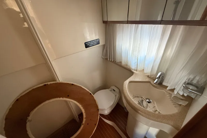 Slide: The Image of Bathroom interior of 2002 Viking Princess V50 yacht with sink and toilet. - 15