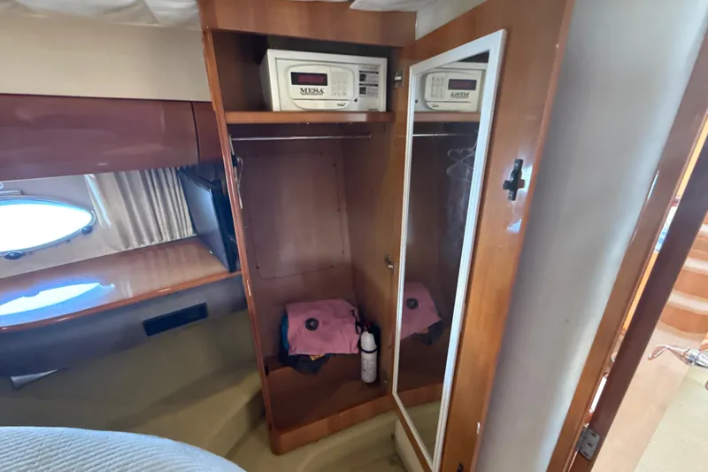 Slide: The Image of Interior of 2002 Viking Princess V50 yacht with wooden wardrobe and safes. - 18