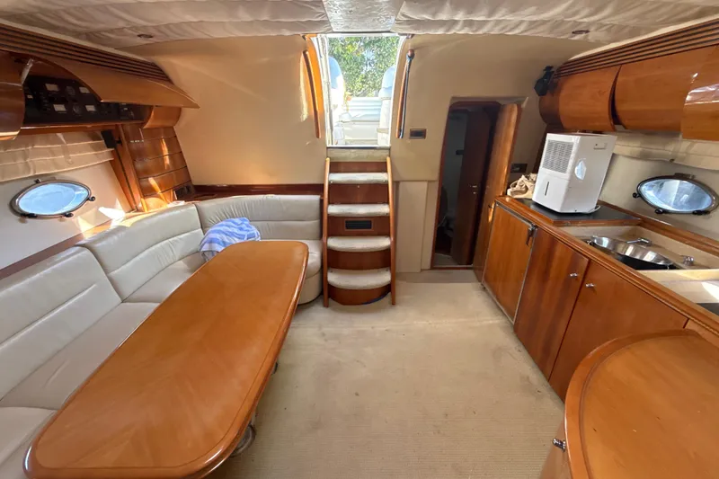 Slide: The Image of Luxurious interior of 2002 Viking Princess V50 yacht with elegant wood finishes. - 19