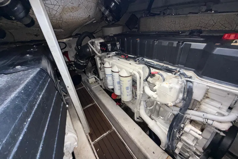 Slide: The Image of Engine room of a 2002 Viking Princess V50 yacht, showcasing detailed machinery. - 23