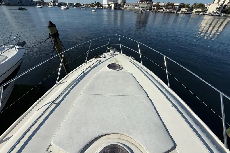 Slide: The Image of Bow view of 2002 Viking Princess V50 yacht docked in a marina. - 25