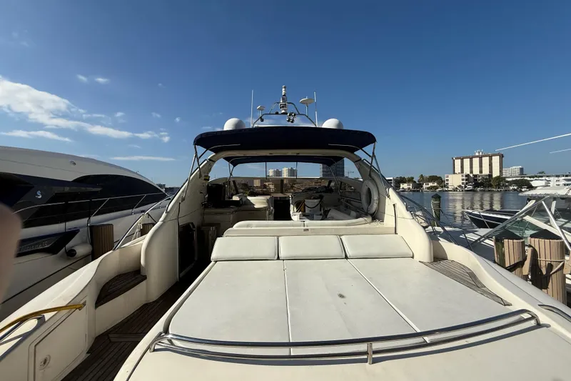 Slide: The Image of 2002 Viking Princess V50 yacht docked at marina under clear blue sky. - 3