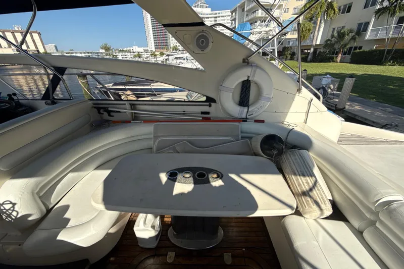 Slide: The Image of Luxurious 2002 Viking Princess V50 yacht interior with white seating and table. - 9