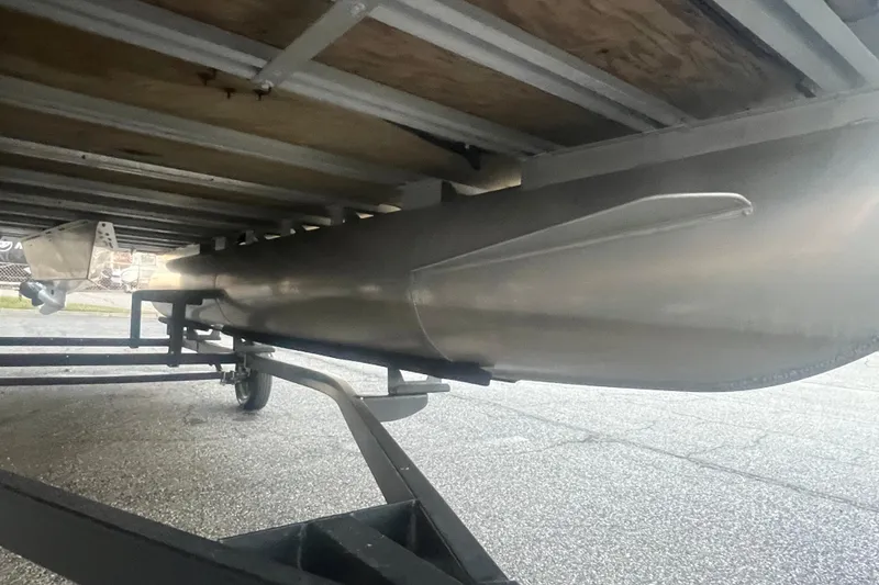 Slide: The Image of Underside view of 2024 Bentley Pontoons 200 Navigator on a trailer. - 11