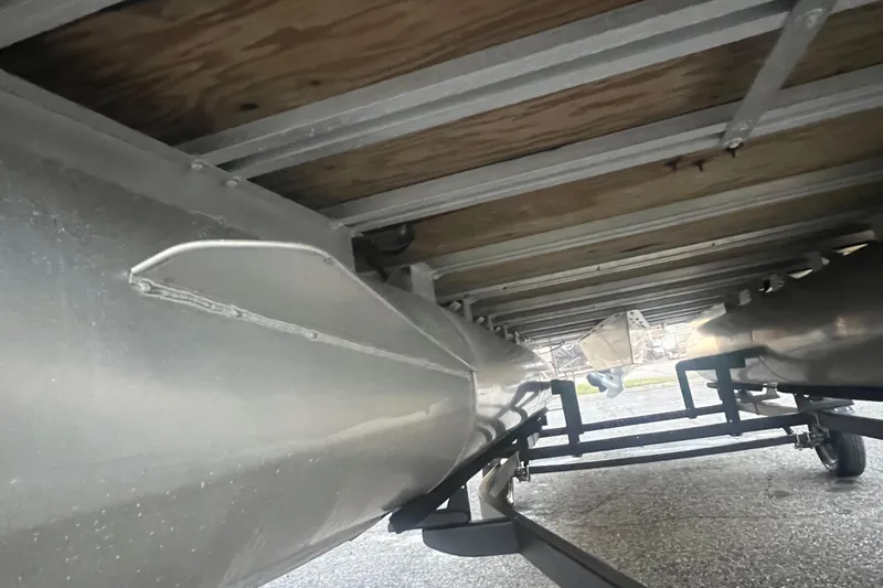 Slide: The Image of Underneath view of a 2024 Bentley Pontoons 200 Navigator, showcasing its sturdy construction. - 12
