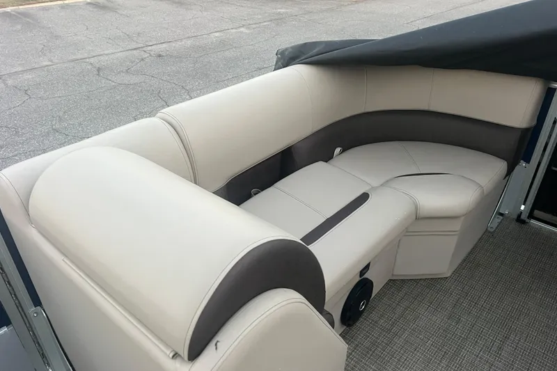Slide: The Image of 2024 Bentley Pontoons 200 Navigator interior seating with beige and gray upholstery. - 14