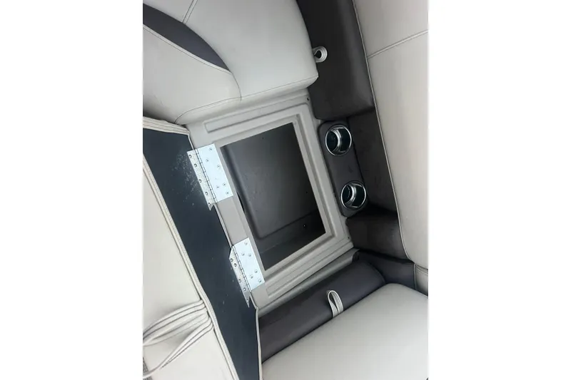 Slide: The Image of 2024 Bentley Pontoons 200 Navigator interior storage compartment with cup holders. - 18