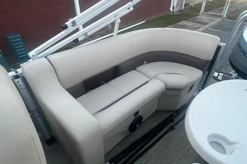 Slide: The Image of 2024 Bentley Pontoons 200 Navigator interior seating with beige upholstery. - 24