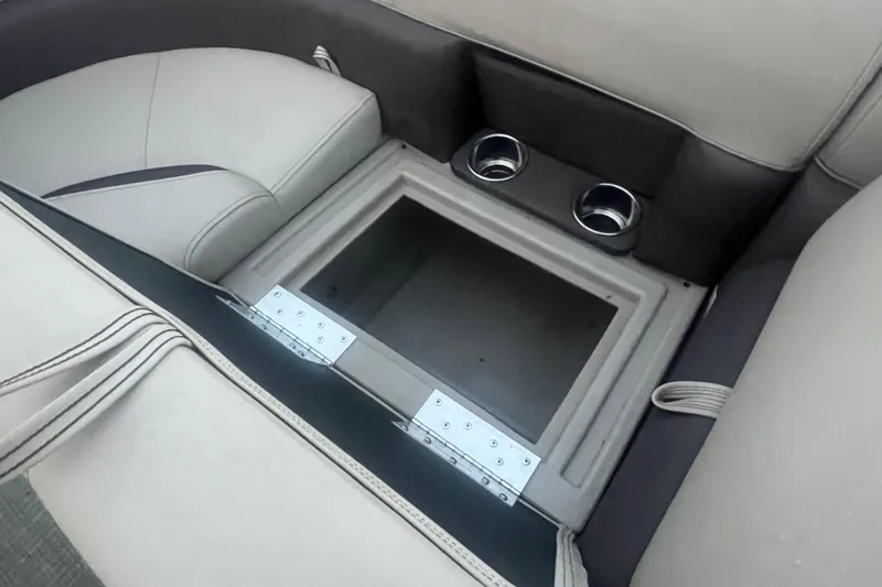 Slide: The Image of 2024 Bentley Pontoons 200 Navigator interior storage compartment with cup holders. - 25