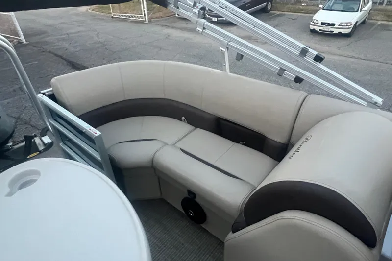 Slide: The Image of 2024 Bentley Pontoons 200 Navigator interior seating with beige and brown upholstery. - 26