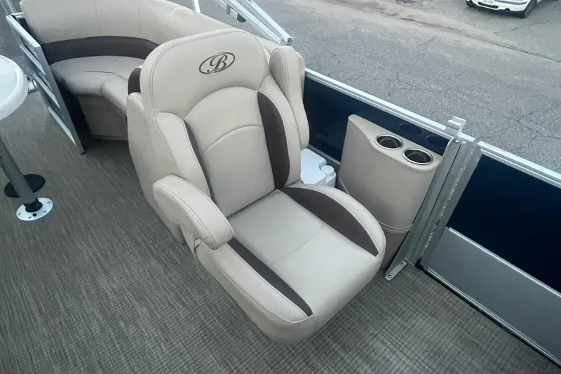 Slide: The Image of 2024 Bentley Pontoons 200 Navigator interior with plush seating and cup holders. - 28