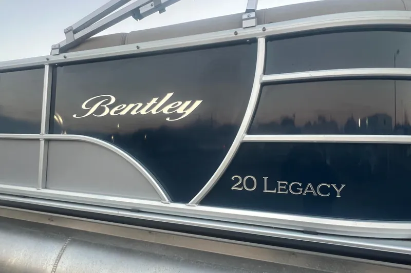 Slide: The Image of 2024 Bentley Pontoons 200 Navigator, side view with "20 Legacy" branding. - 3