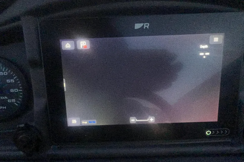 Slide: The Image of 2024 Bentley Pontoons 200 Navigator dashboard display with depth settings and controls. - 30