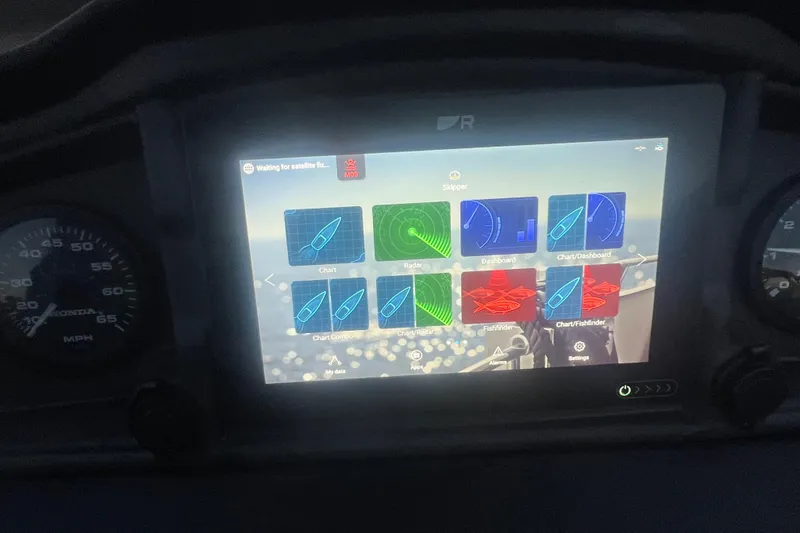 Slide: The Image of Dashboard of 2024 Bentley Pontoons 200 Navigator with digital navigation display. - 32