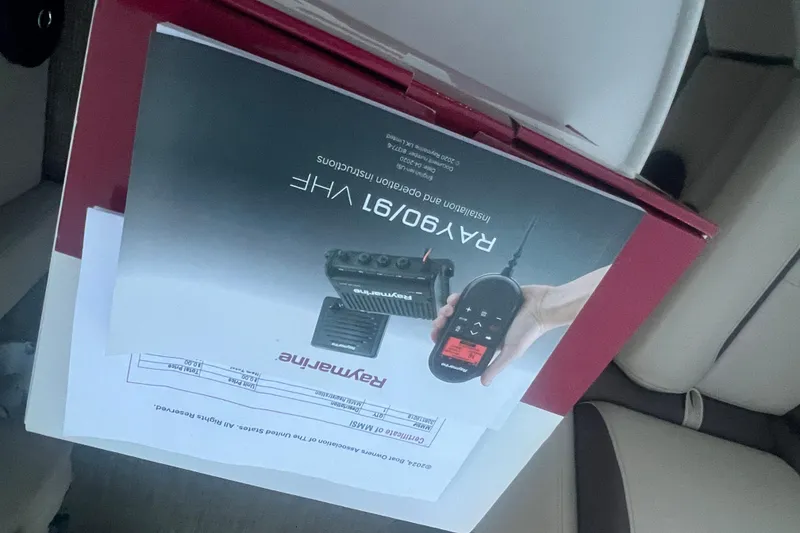 Slide: The Image of Box of Raymarine VHF radio on Bentley Pontoons 200 Navigator 2024 seat. - 33