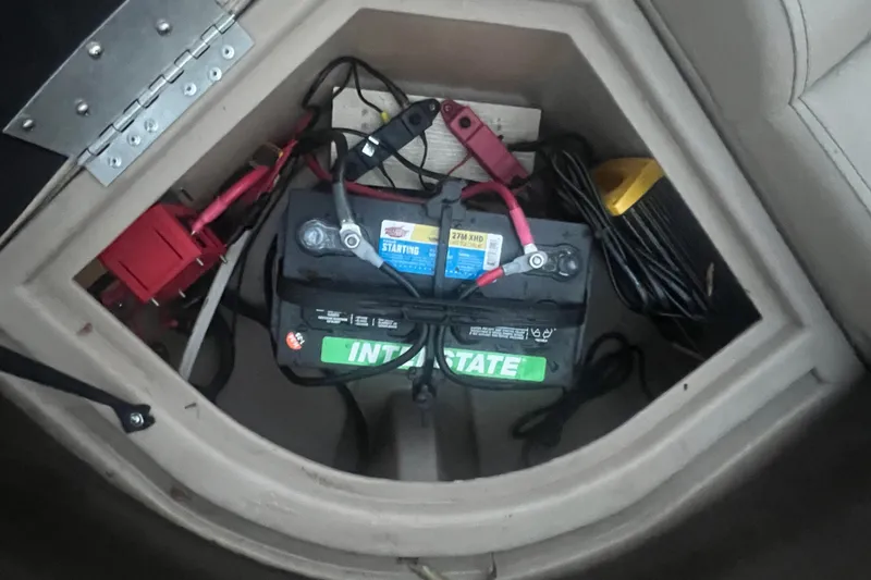 Slide: The Image of Battery compartment of 2024 Bentley Pontoons 200 Navigator with wiring and components. - 35