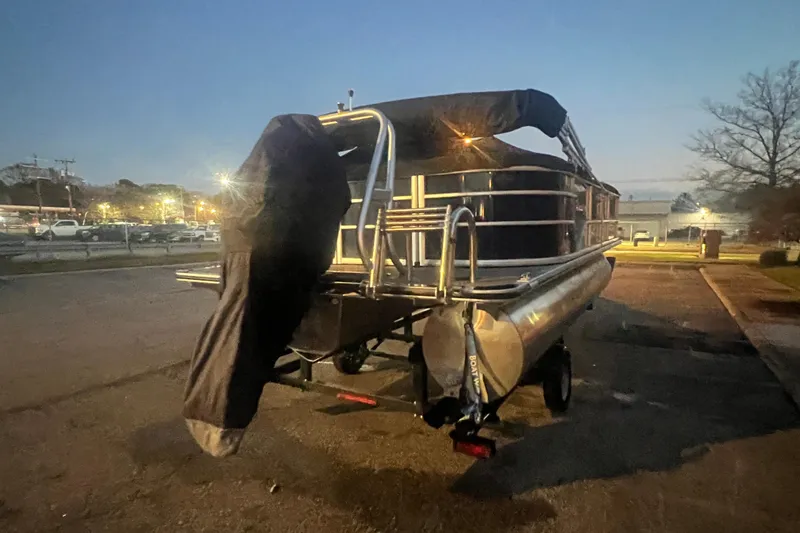 Slide: The Image of 2024 Bentley Pontoons 200 Navigator at dusk in parking lot. - 39