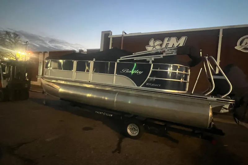 Slide: The Image of 2024 Bentley Pontoons 200 Navigator at dusk, parked on a trailer. - 41