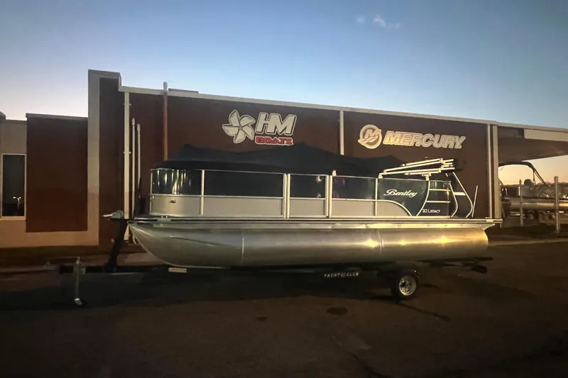 Slide: The Image of 2024 Bentley Pontoons 200 Navigator at dealership, evening setting. - 43