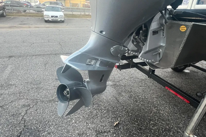 Slide: The Image of 2024 Bentley Pontoons 200 Navigator outboard motor and propeller on a trailer. - 6