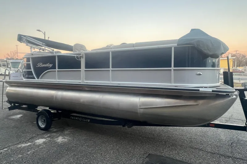 Slide: The Image of 2024 Bentley Pontoons 200 Navigator on trailer at sunset. - 9