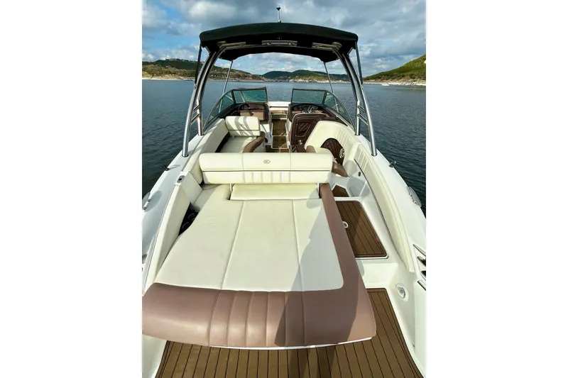 Slide: The Image of 2011 Cobalt 276 boat with spacious seating on a calm lake. - 21