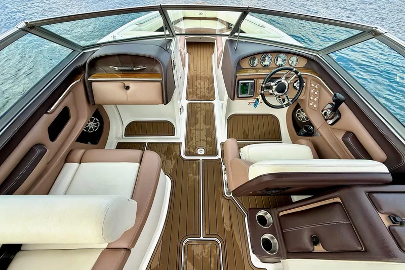 Slide: The Image of Luxurious interior of a 2011 Cobalt 276 boat with elegant seating and dashboard. - 23