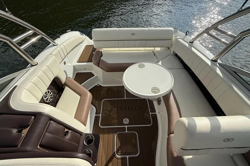 Slide: The Image of Luxurious interior of 2011 Cobalt 276 boat with elegant seating and table. - 26