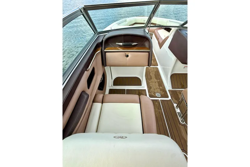 Slide: The Image of Interior of 2011 Cobalt 276 boat with luxurious seating and wood flooring. - 29