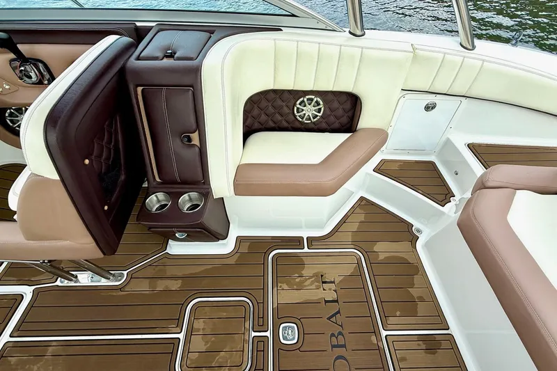 Slide: The Image of Luxurious interior of 2011 Cobalt 276 boat with brown and white seating. - 31