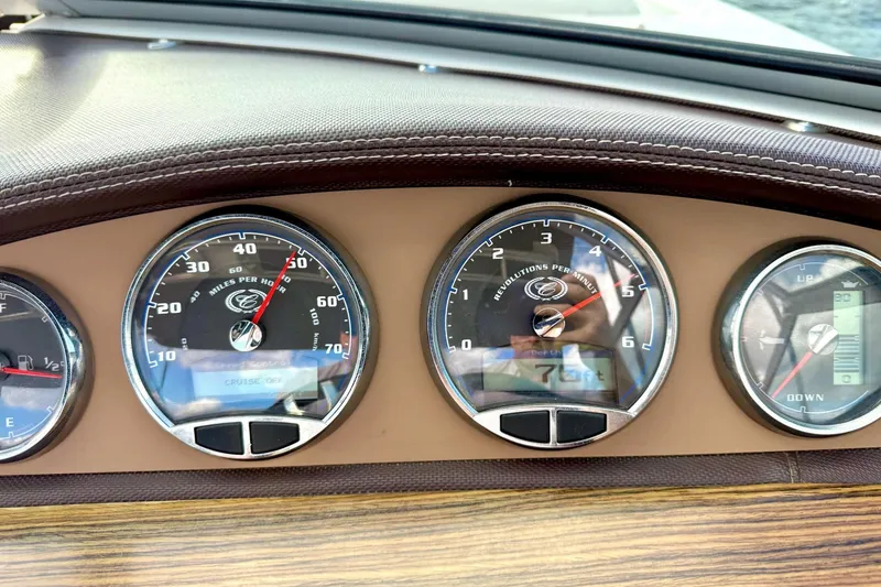 Slide: The Image of Dashboard of a 2011 Cobalt 276 boat showing speedometer and gauges. - 40