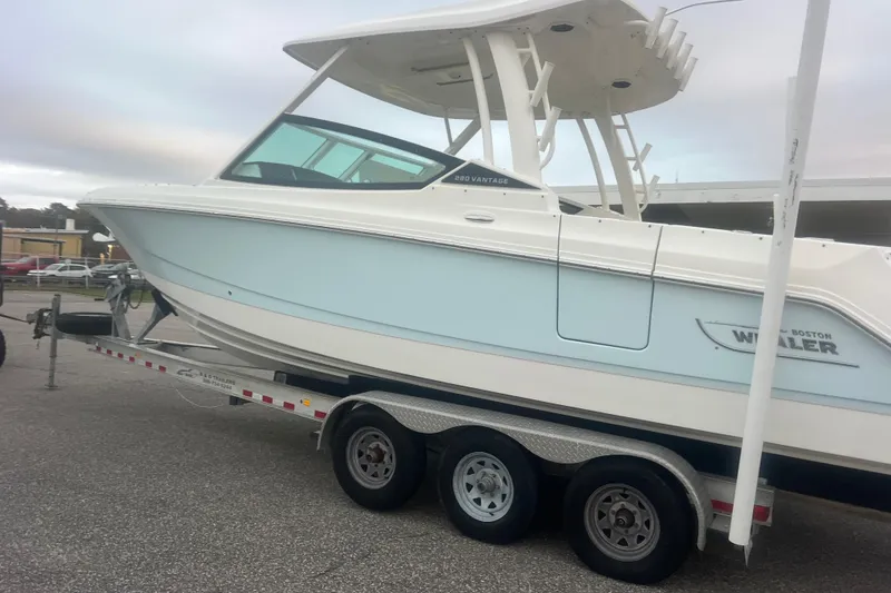 Slide: The Image of 2023 Boston Whaler 280 Vantage boat on a trailer, side view. - 2
