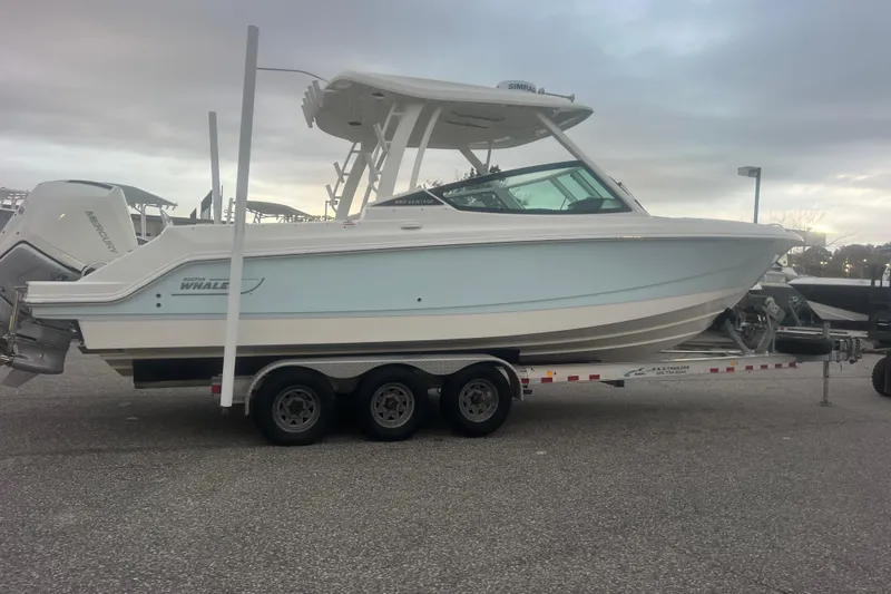 Slide: The Image of 2023 Boston Whaler 280 Vantage boat on a trailer, side view. - 22